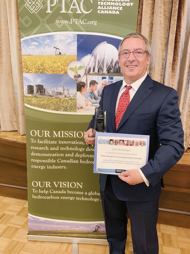 Photograph of Steve Froehler holding LCO's 2018 Commercialization of SME Technology award