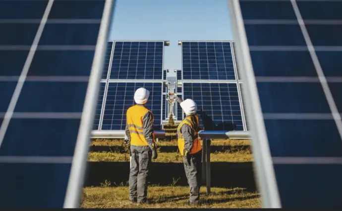 Workers with solar panels